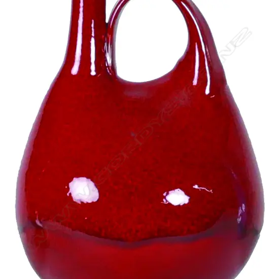 Len Castle ceremonial pourer in a striking lava red glaze
