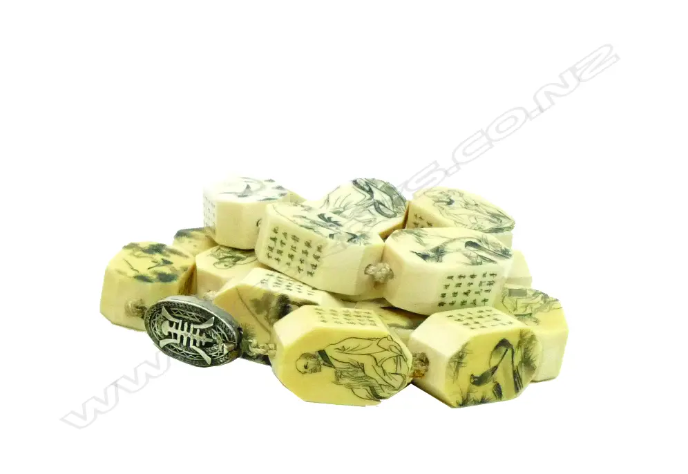 A Chinese carved ivory large bead necklace Image 1++