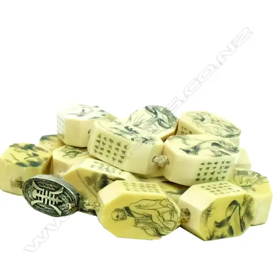 A Chinese carved ivory large bead necklace