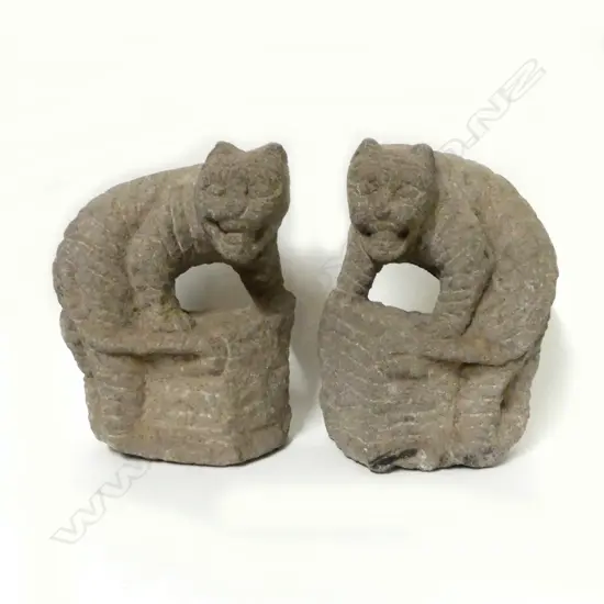 Two carved stone Chinese temple lions