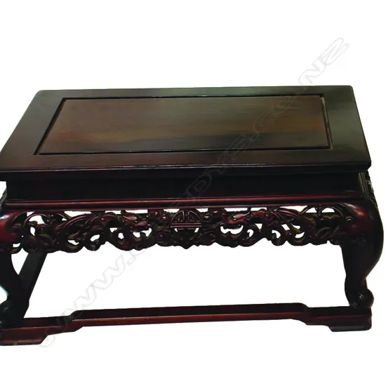 A Chinese carved hardwood small low vase table