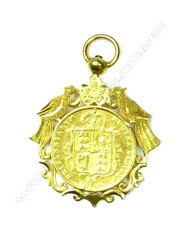 A 22ct gold framed half sovereign Image 1++