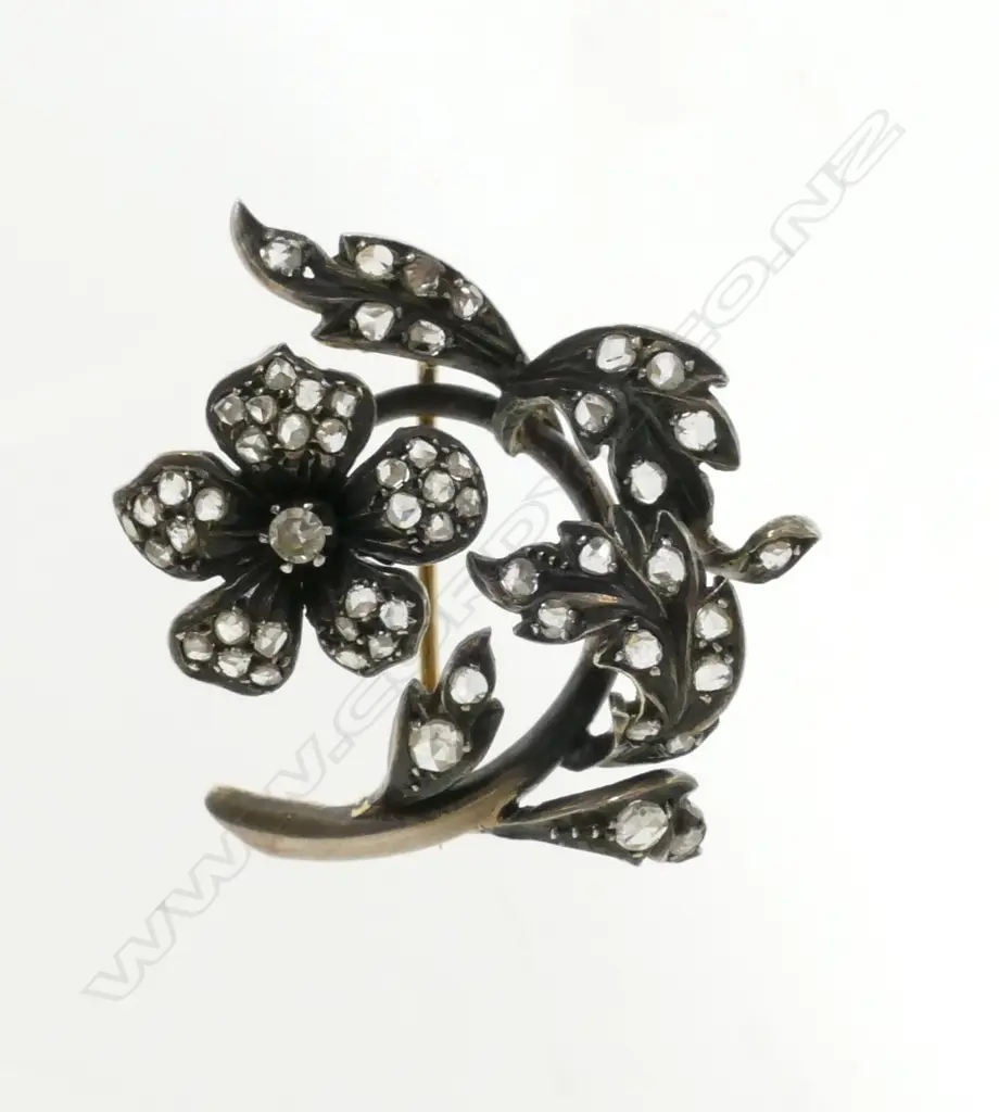 A 14ct. gold and diamond brooch Image 1++