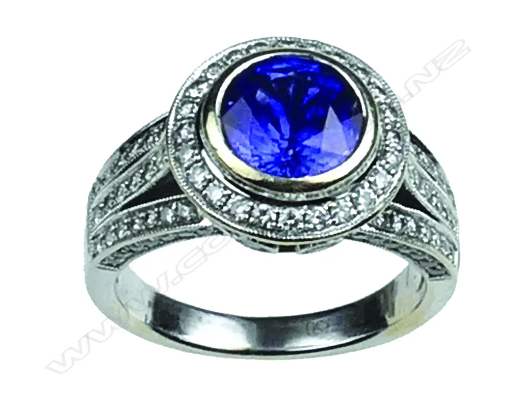 An 18ct. white gold sapphire and diamond ring Image 1++