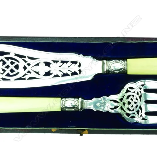 A pair of silver plate and ivory handled fish servers
