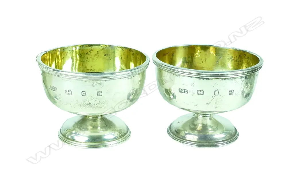 A pair of small heavy silver circular stem cups Image 1++