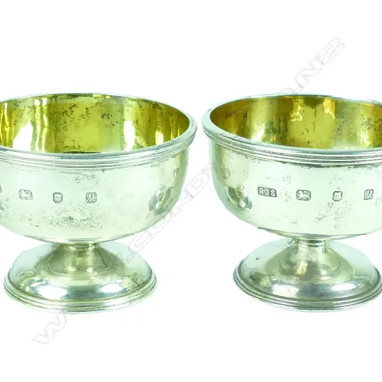A pair of small heavy silver circular stem cups