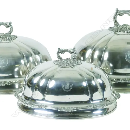 An impressive set of three graduated William IV Old Sheffield Plate meat dish covers