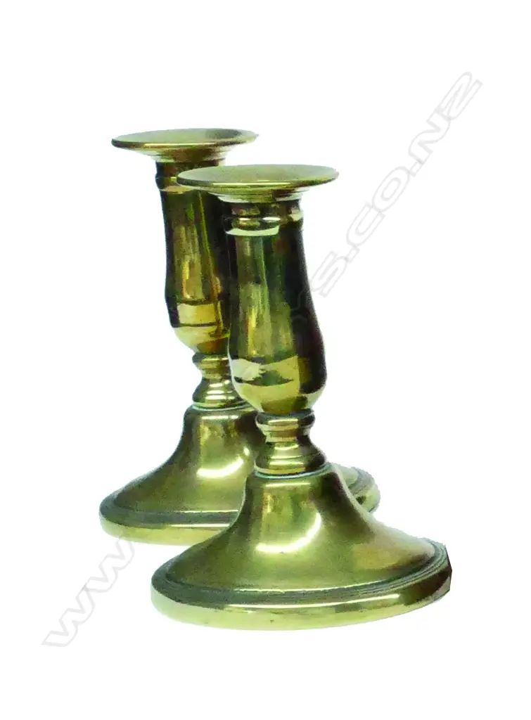 A pair of Georgian brass short column candlesticks Image 1++