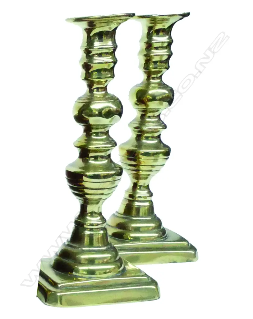 A pair of Victorian brass column ejector candlesticks Image 1++