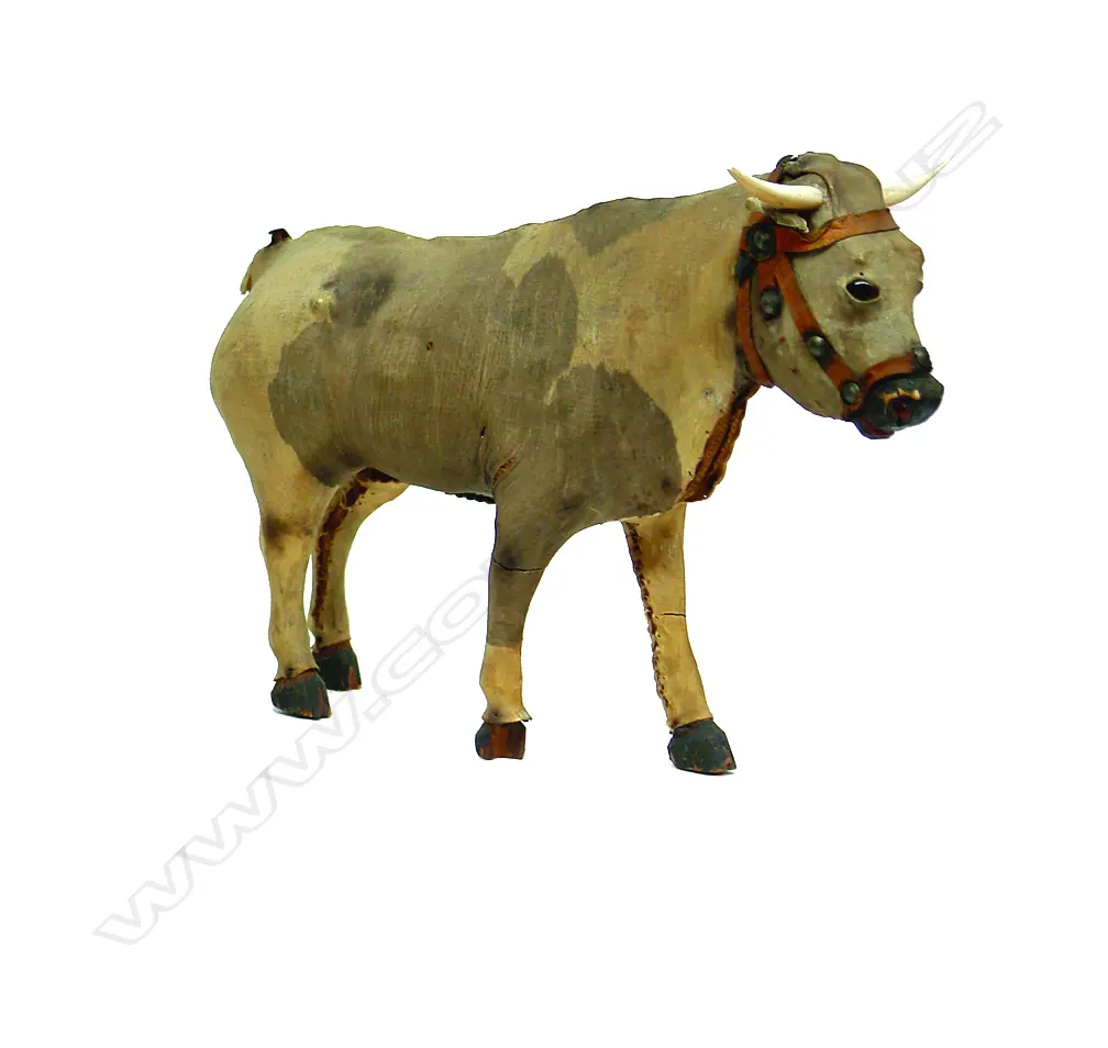 A mid-19thC vellum on carved wood child's toy bull Image 1++