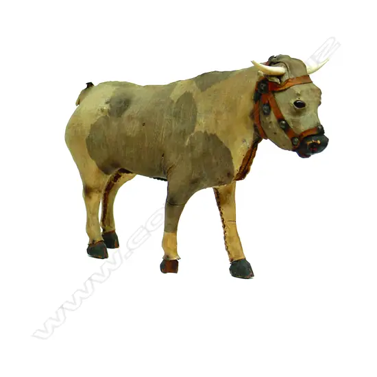 A mid-19thC vellum on carved wood child's toy bull