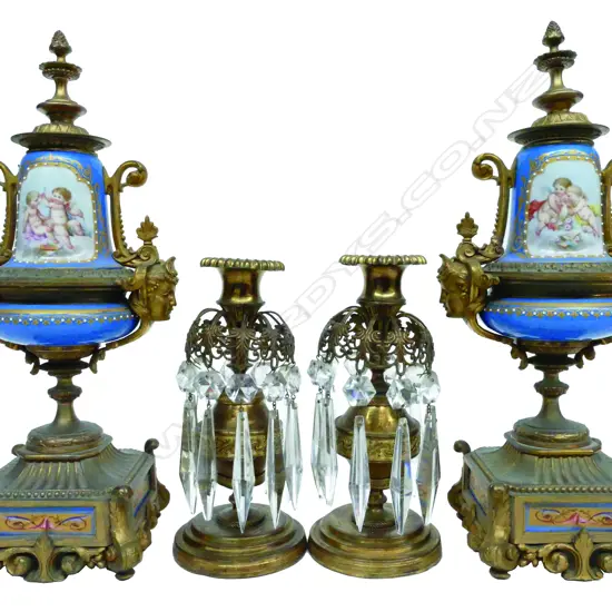 A pair of French mid-19thC gilt metal garniture castlettes with porcelain bodies in the manner of Sèvres
