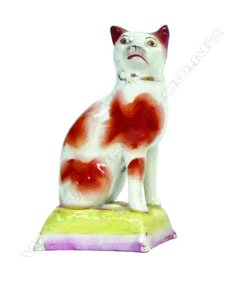 A rare 19thC Staffordshire model of a seated cat Image 1++