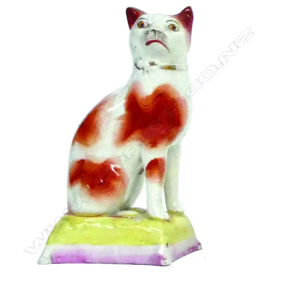 A rare 19thC Staffordshire model of a seated cat