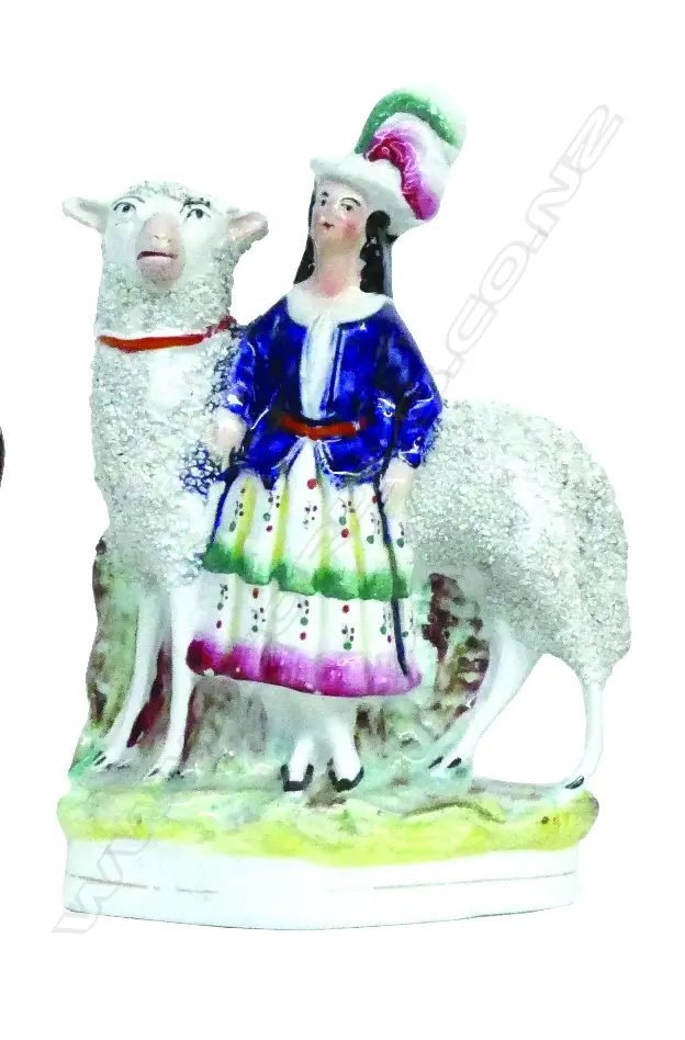 A Victorian Staffordshire figure group of a Scottish woman with sheep Image 1++