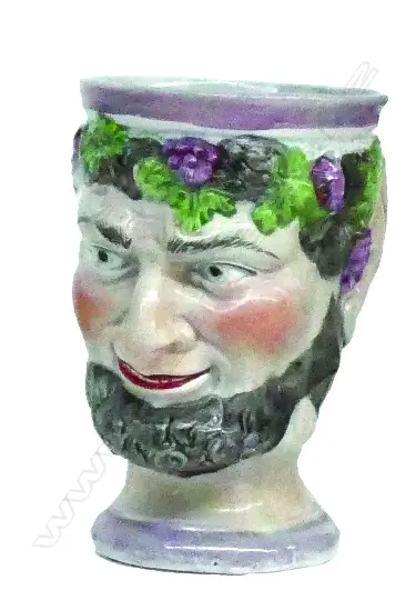 A rare 19thC Staffordshire Bacchus mask jug Image 1++