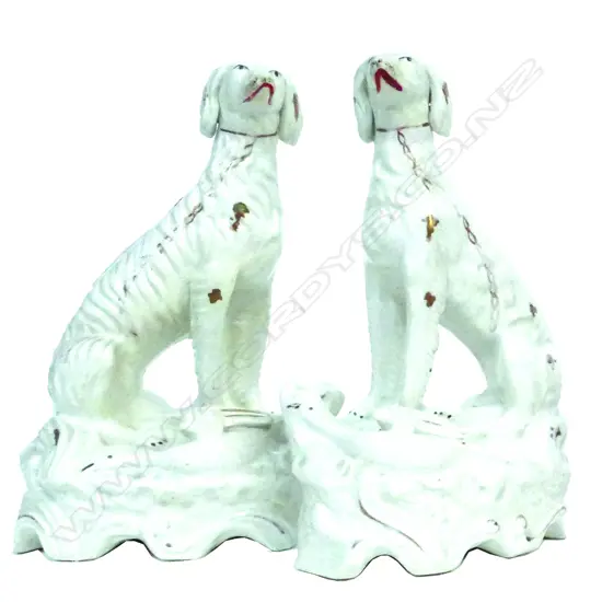 A pair of Victorian Staffordshire seated wolfhound figures