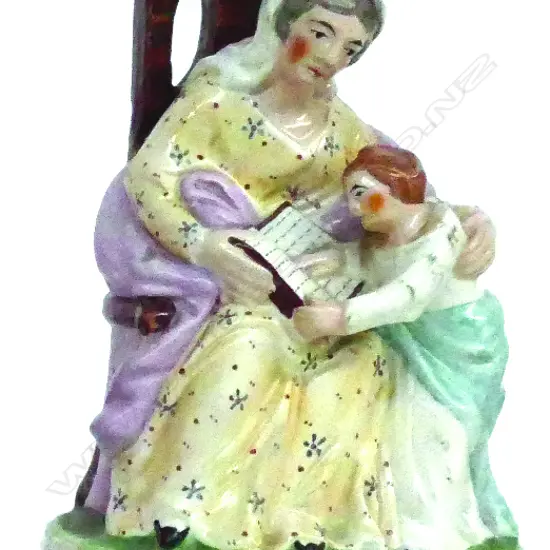 A Victorian Staffordshire figure group 'The Reading Lesson'