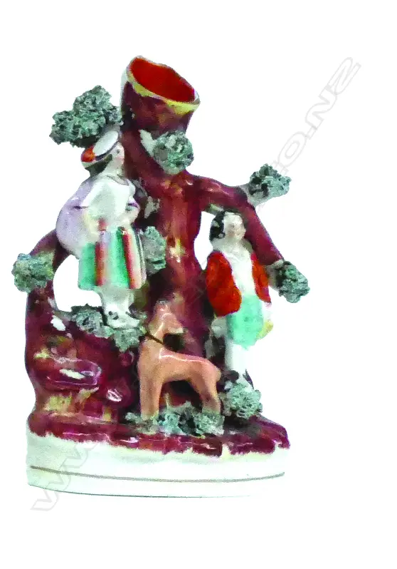 A Victorian Staffordshire figured spill vase Image 1++