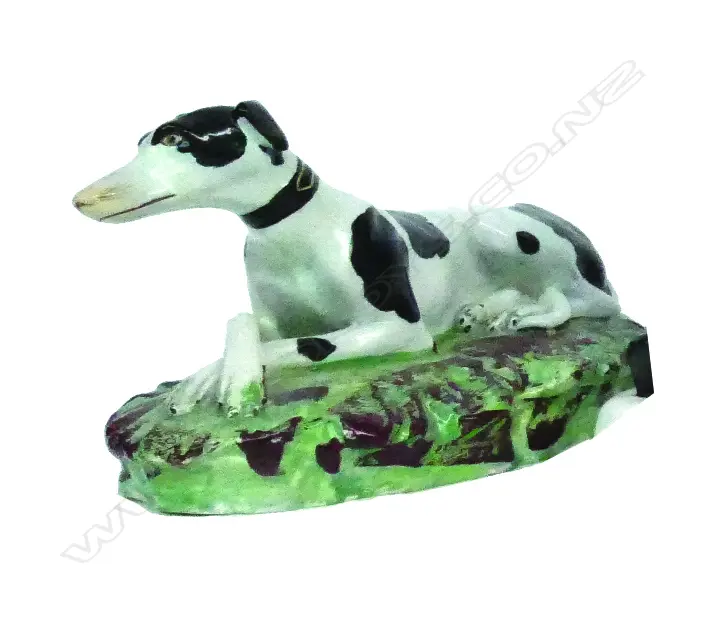 A Victorian Staffordshire reclining hound Image 1++