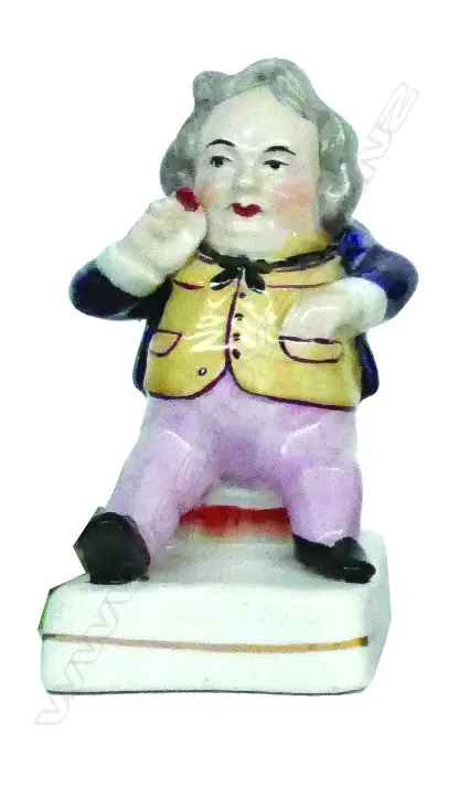 A 19thC Staffordshire figure of a snuff taker Image 1++