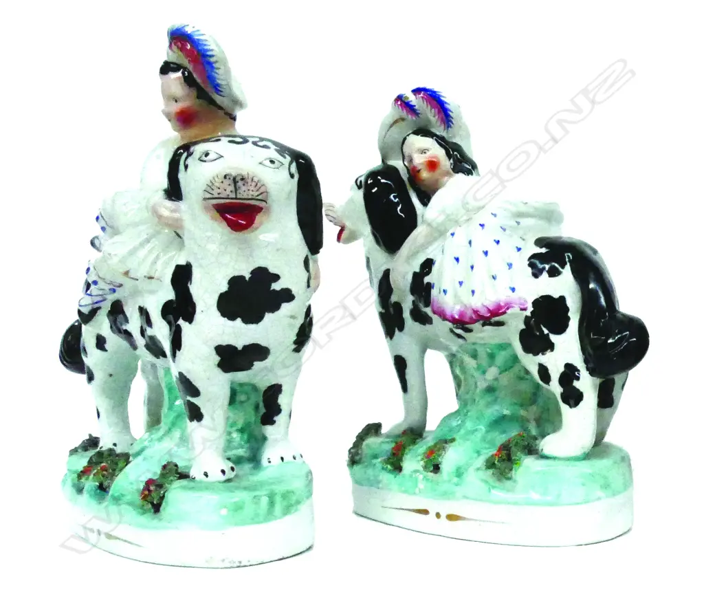 A  rare pair of 19thC Staffordshire figure groups of Saint Bernard dogs with the Scottish royal children Image 1++