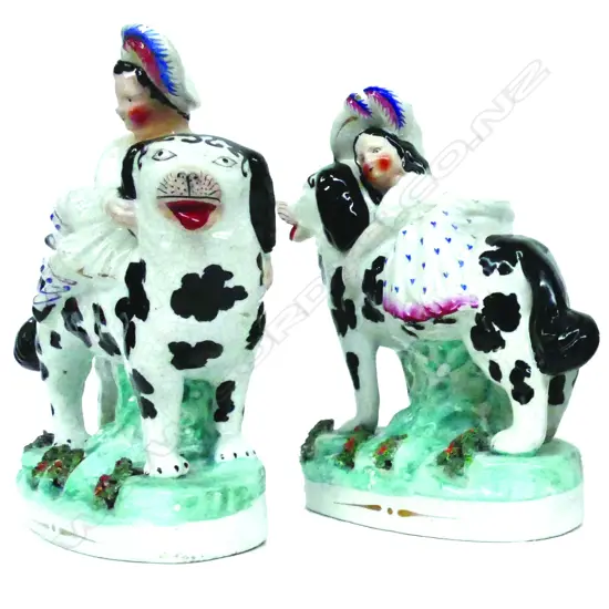 A  rare pair of 19thC Staffordshire figure groups of Saint Bernard dogs with the Scottish royal children