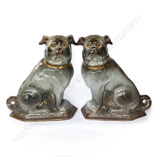 A pair of 19thC porcelain small pug dog ornaments