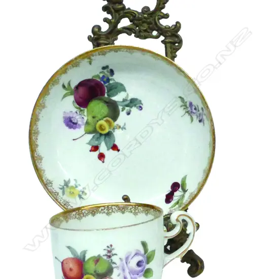 A 19thC Meissen fruit decorated cup and saucer