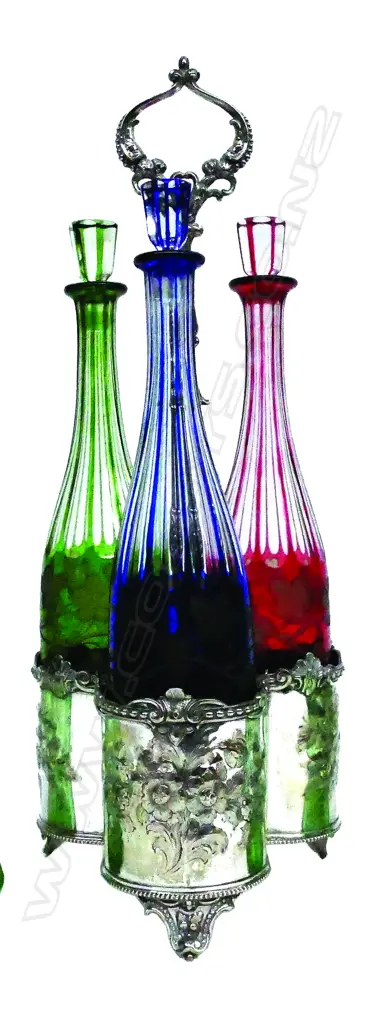 A 19thC silver plate and Bohemian three-bottle tantalus Image 1++