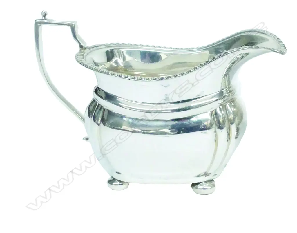 A Georgian Revival silver milk jug Image 1++
