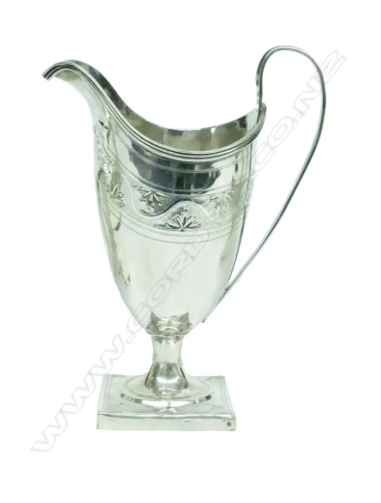 A George III silver helmet cream jug Image 1++