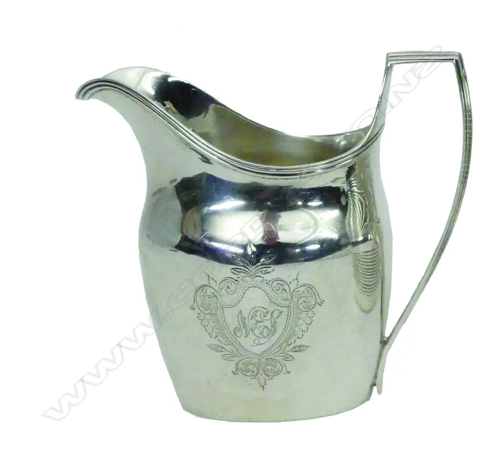 A George III silver flat bottom cream jug Image 1++
