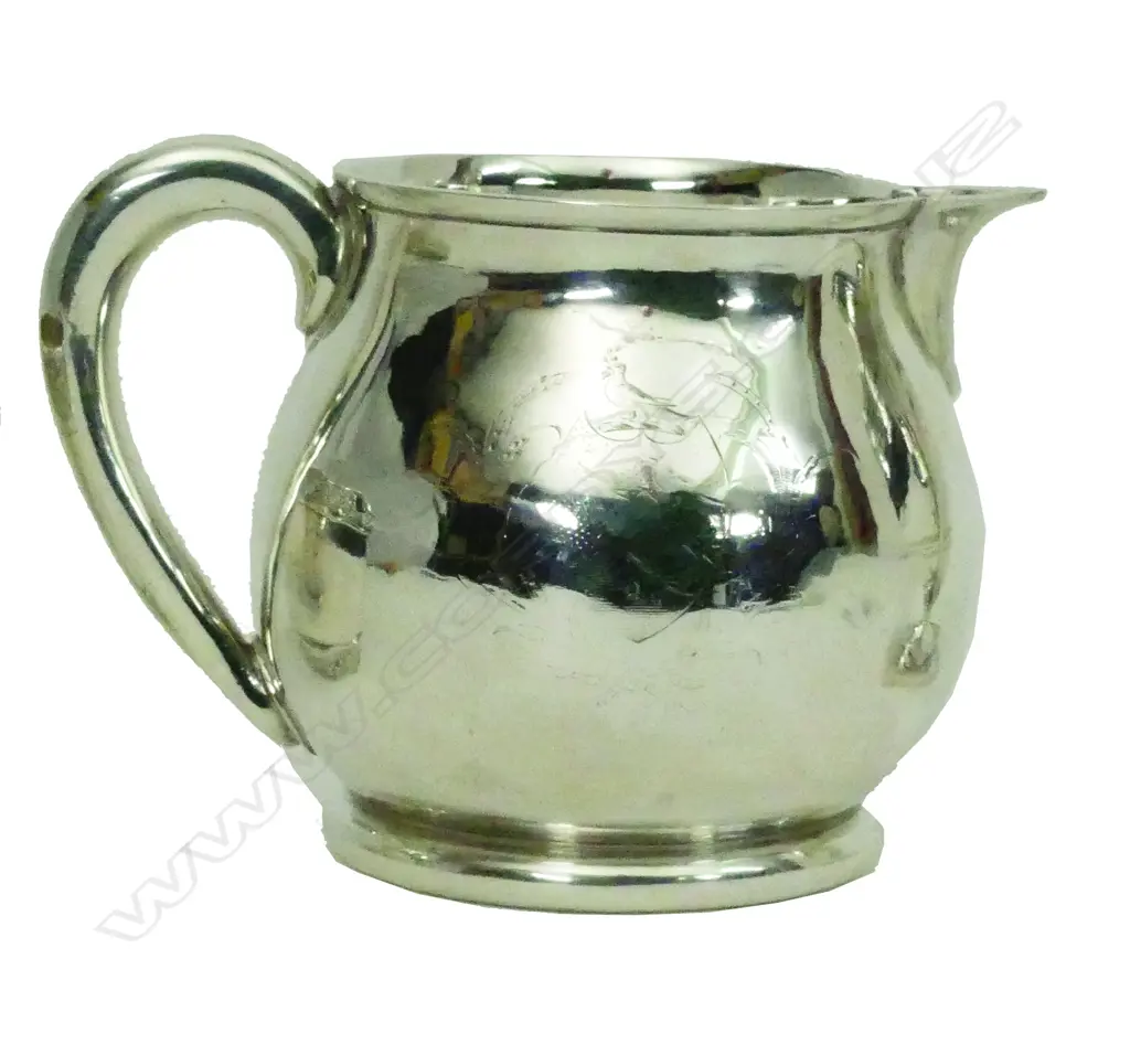A particularly heavy George II silver milk jug Image 1++