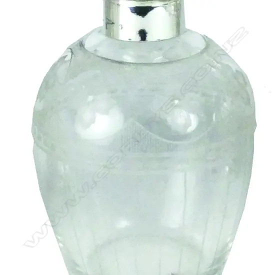 An early 20thC silver and tortoiseshell topped cut crystal scent bottle