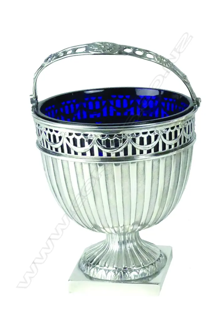 A Victorian silver swing handled sugar basket with original Bristol Blue glass liner Image 1++