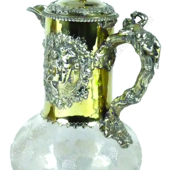An impressive Victorian silver gilt and cut glass claret jug
