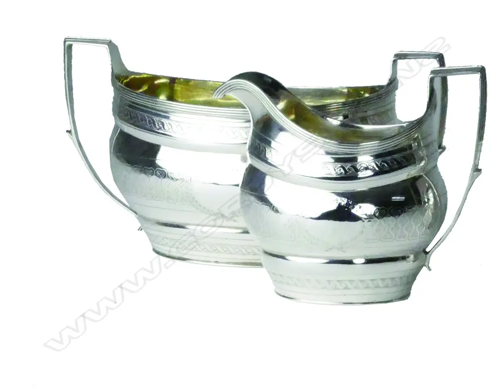 A pair of Geo.III silver cream jug and sugar bowl Image 1++