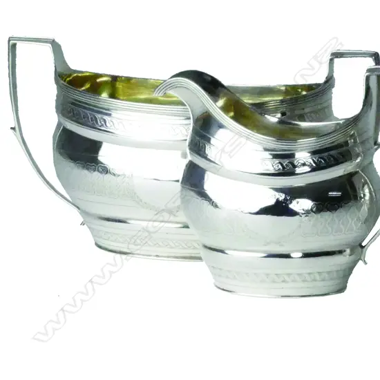 A pair of Geo.III silver cream jug and sugar bowl