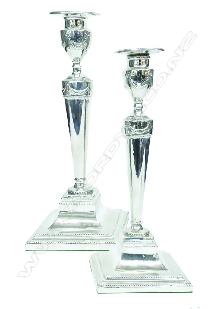 A pair of Geo. III silver candlesticks in the Adams' manner Image 1++