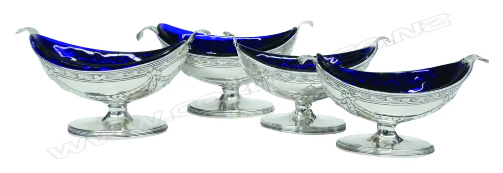 A rare set of four Geo. III boat-shaped silver salts Image 1++