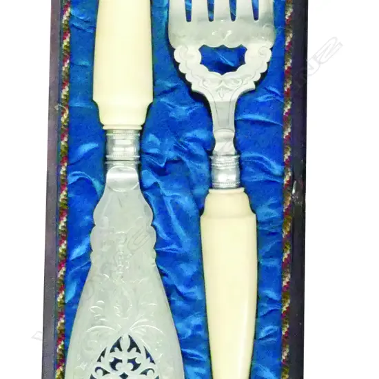 A cased pair of late 19thC fish servers with ivory handles