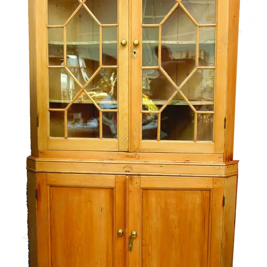 A Geo.III pine standing corner cabinet
