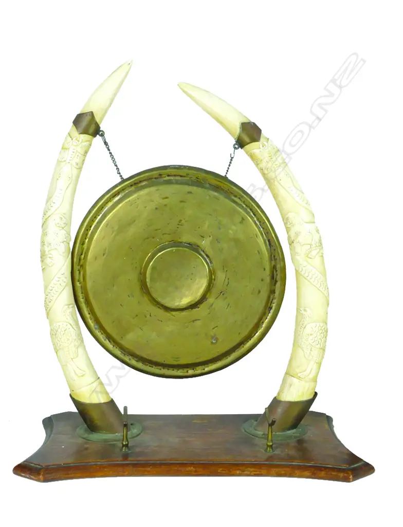 A dinner gong supported from ivory tusks Image 1++
