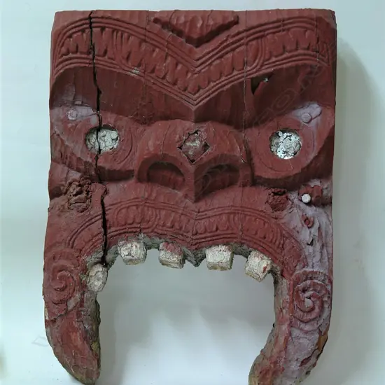 A 19thC Maori carved stylised mask