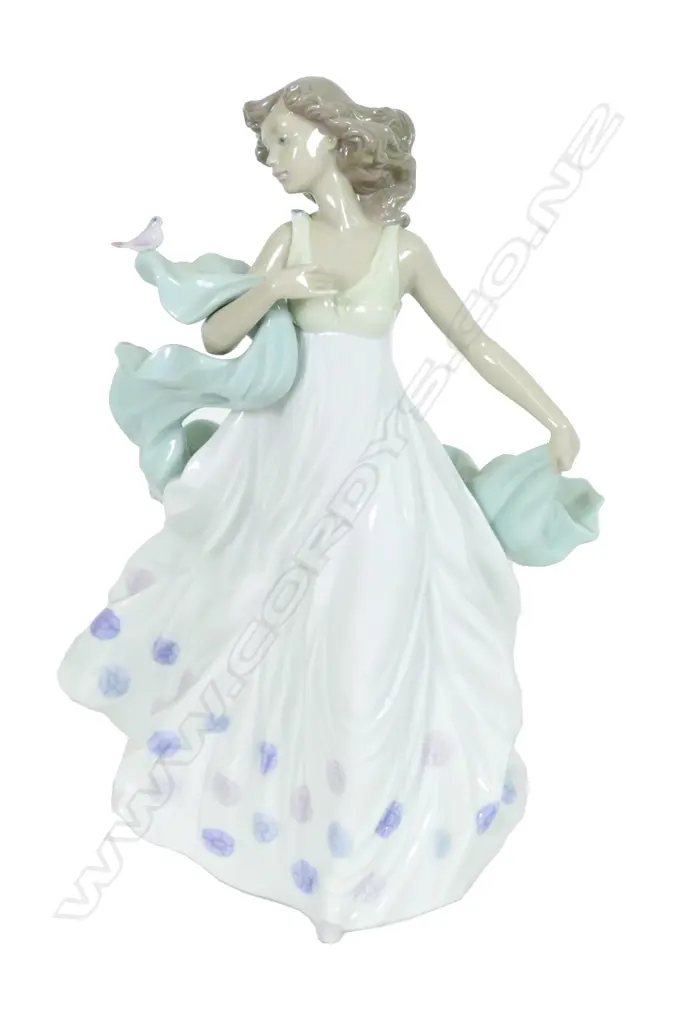 A Lladro porcelain figure 'Summer Serenade' modelled by Regino Torrijos Image 1++