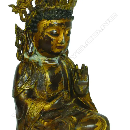 A gilded metal Buddha statuette