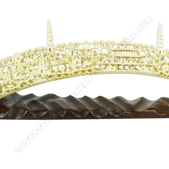 An old and elaborately carved Chinese ivory tusk