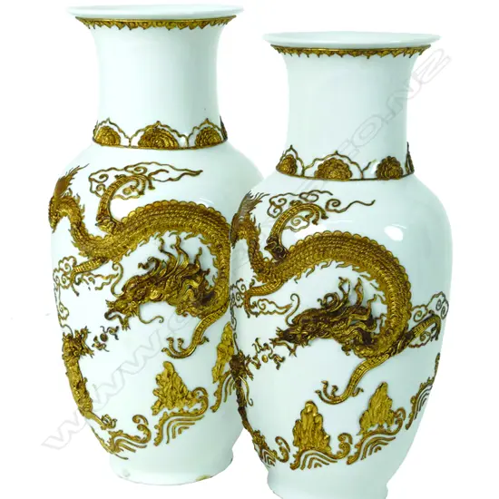 A pair of Chinese white baluster porcelain vases
